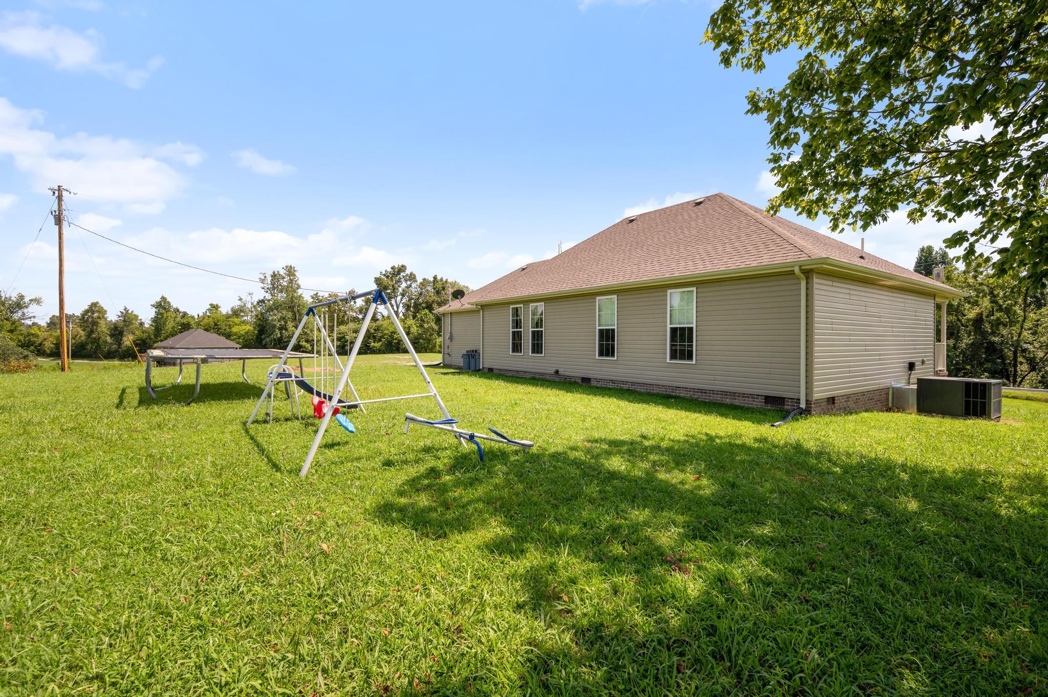7040 Charity Road Petersburg, TN 37144 - Photo 24 of 36 a view of a house with a backyard