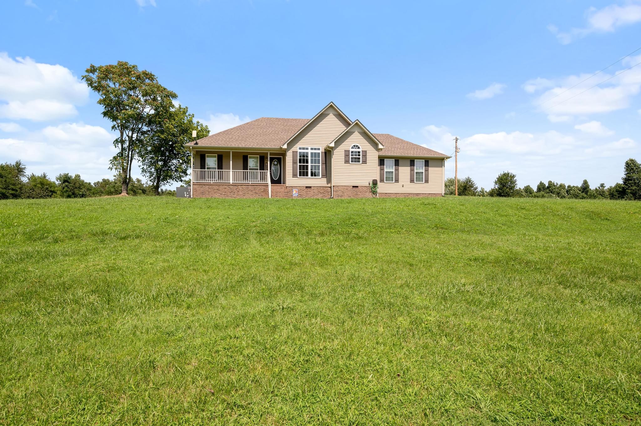 7040 Charity Road Petersburg, TN 37144 - Photo 27 of 36 a front view of a house with garden