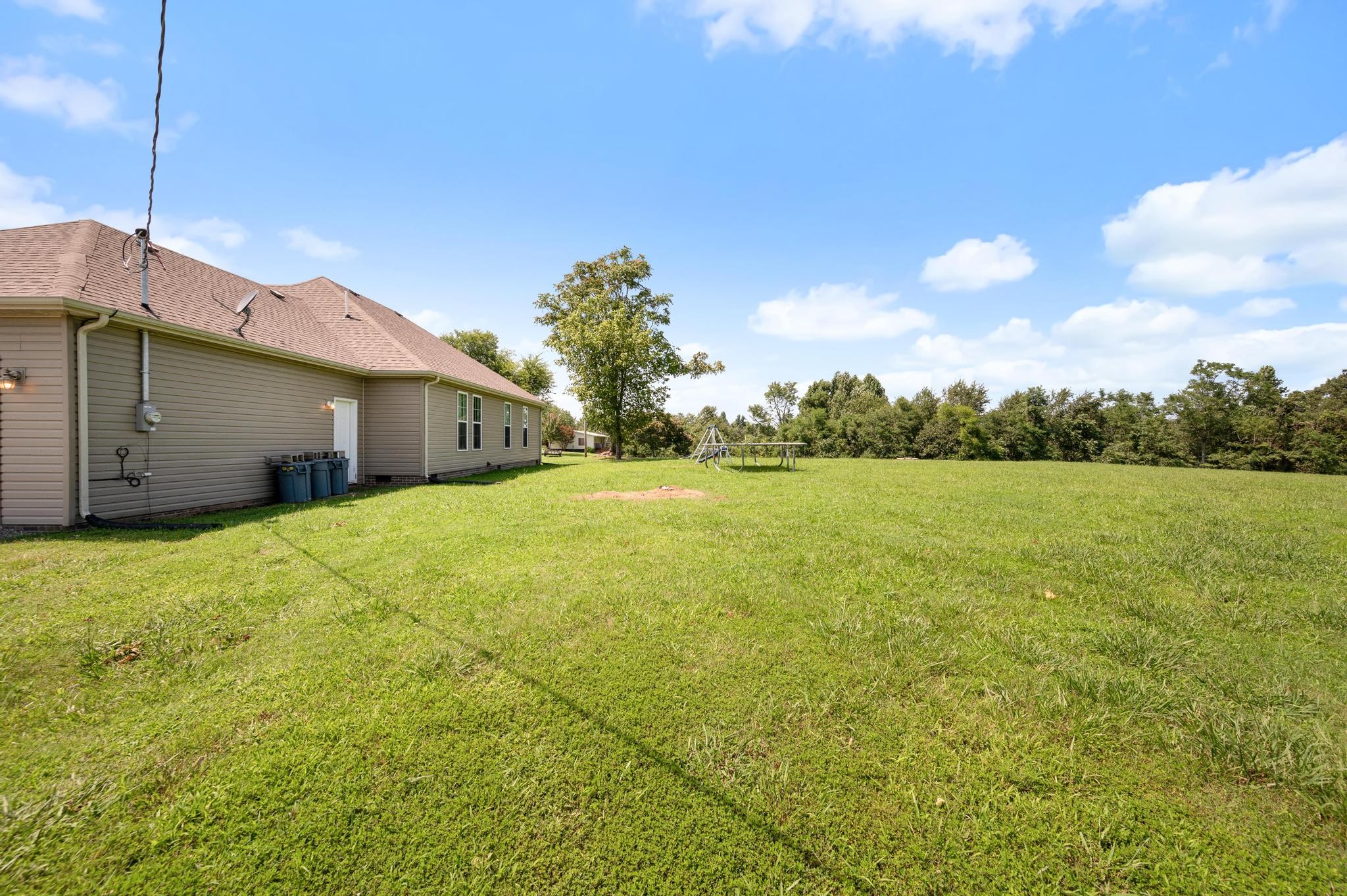 7040 Charity Road Petersburg, TN 37144 - Photo 29 of 36 a front view of house with yard and green space