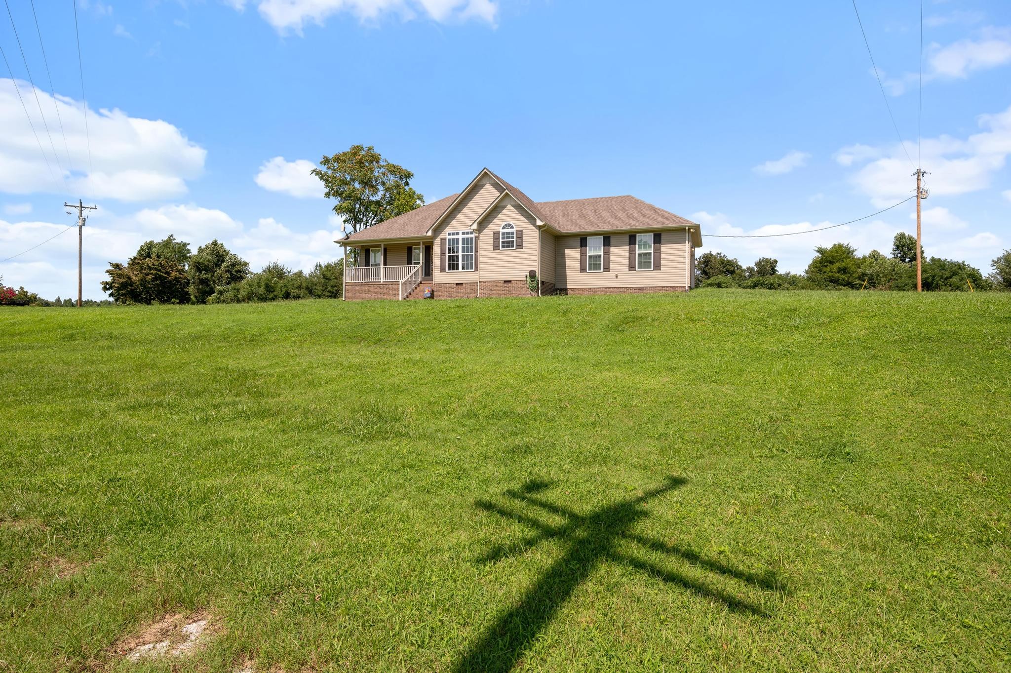 7040 Charity Road Petersburg, TN 37144 - Photo 30 of 36 a front view of a house with garden