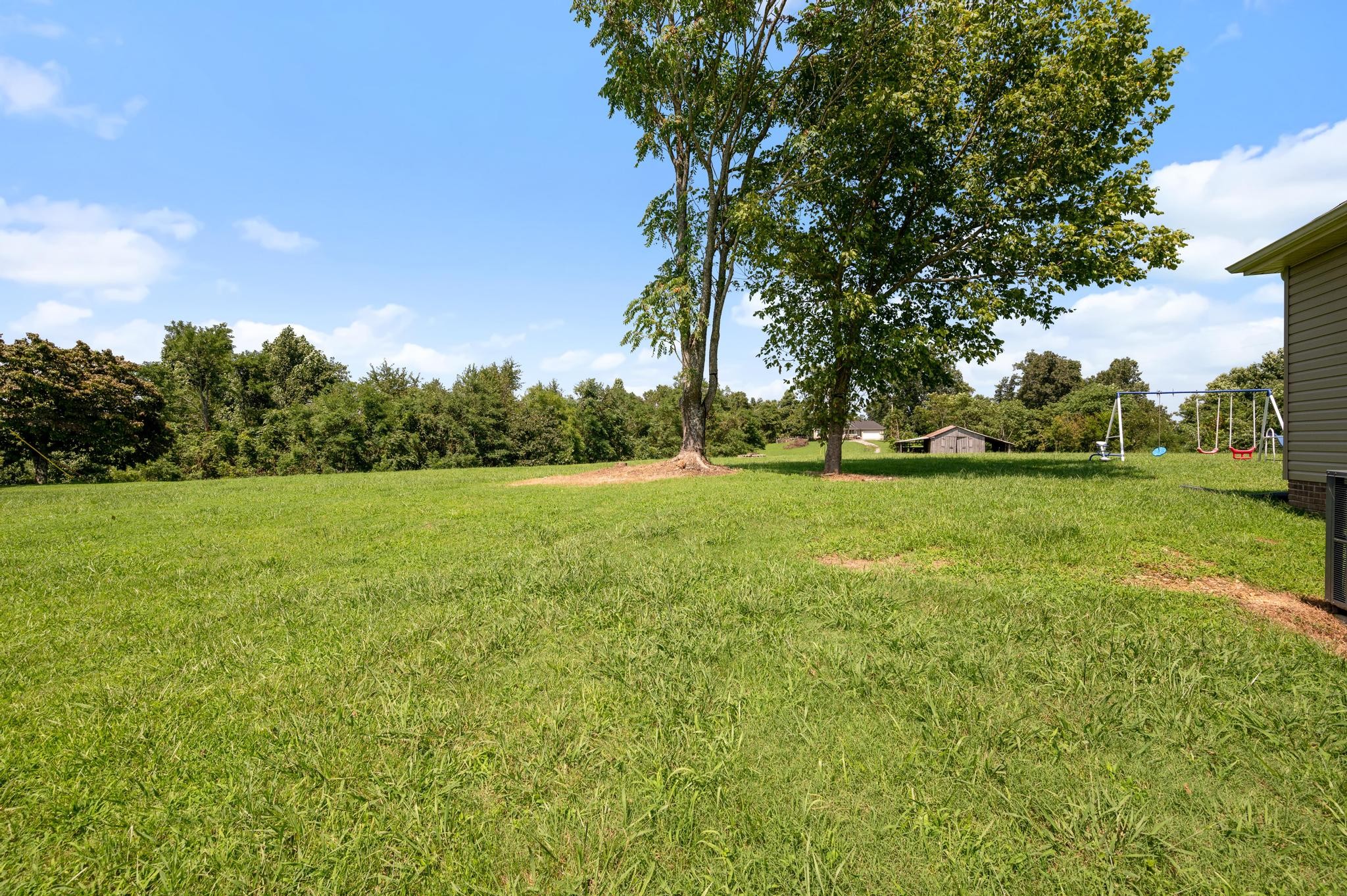 7040 Charity Road Petersburg, TN 37144 - Photo 32 of 36 a view of a green field with wooden fence