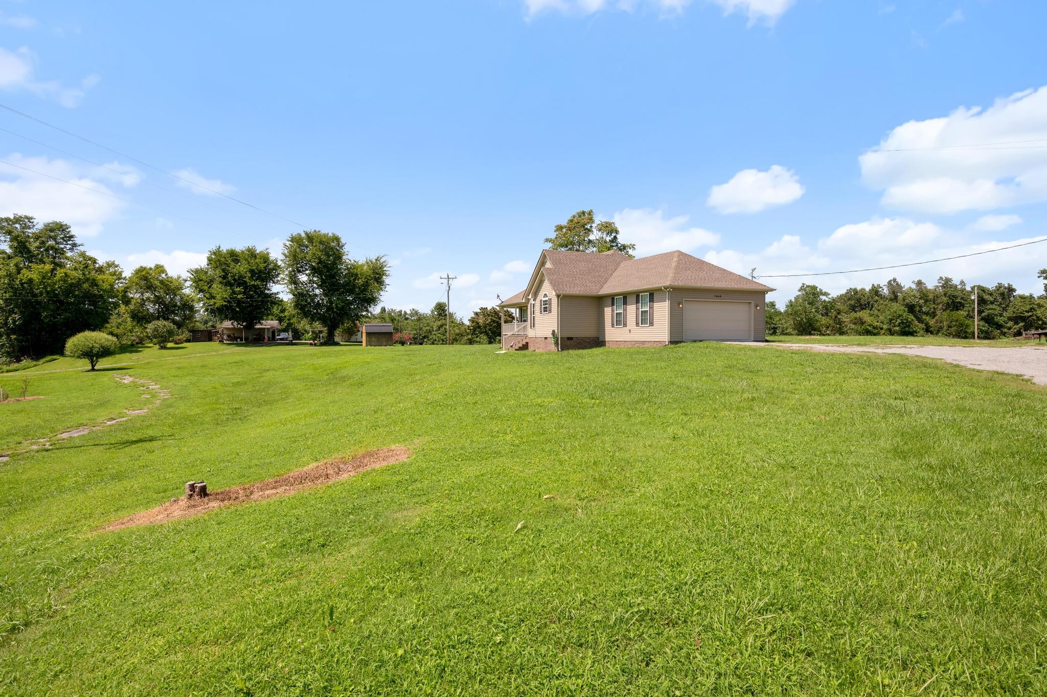 7040 Charity Road Petersburg, TN 37144 - Photo 35 of 36 a view of a large garden with a house in the background
