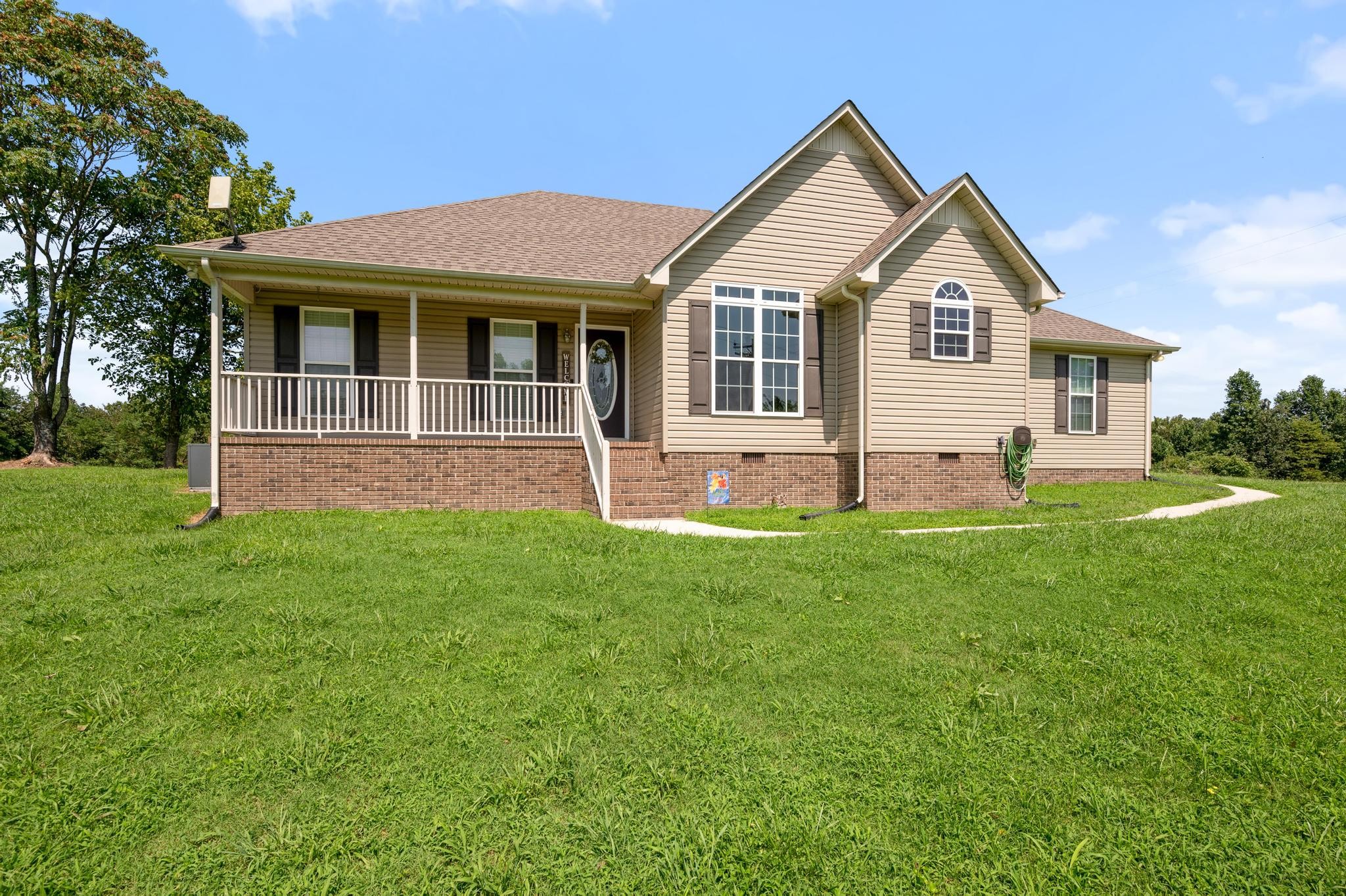7040 Charity Road Petersburg, TN 37144 - Photo 5 of 36 a front view of a house with a yard