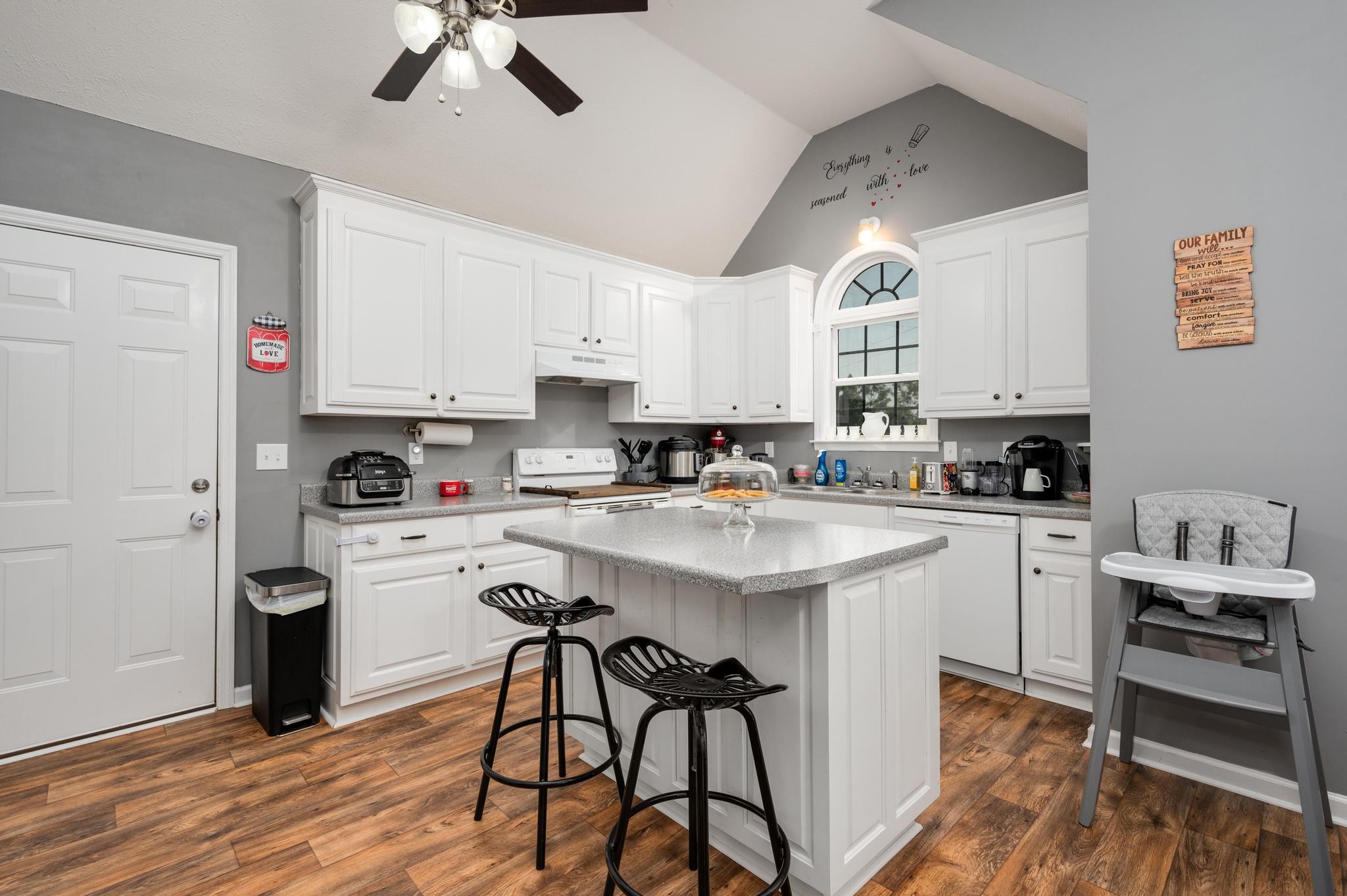 7040 Charity Road Petersburg, TN 37144 - Photo 6 of 36 a kitchen with stainless steel appliances granite countertop a white cabinets and stove top oven