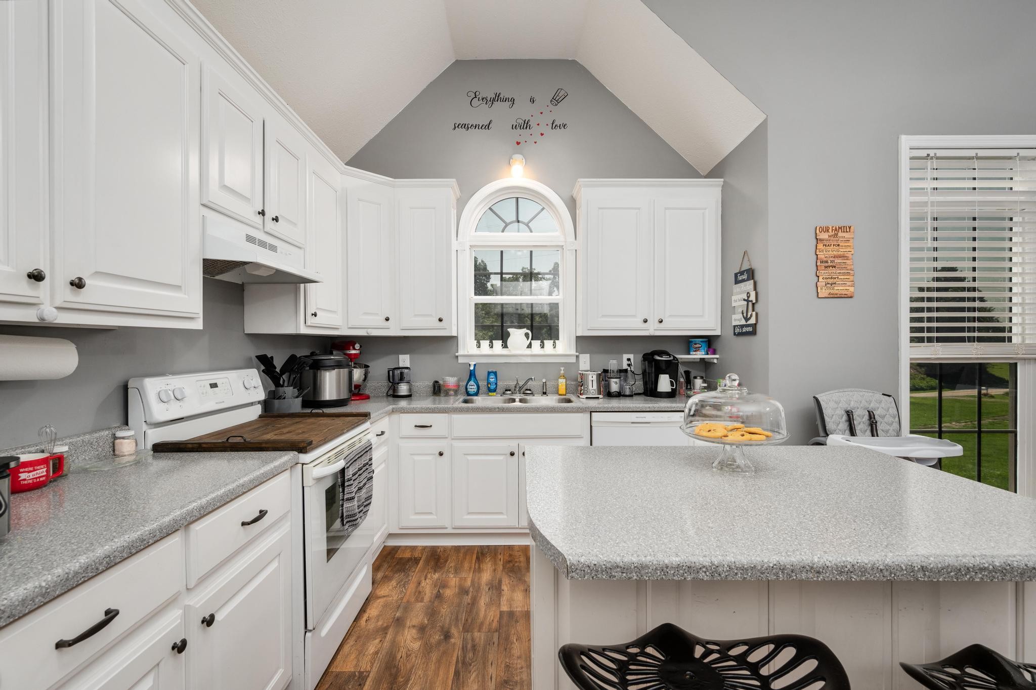 7040 Charity Road Petersburg, TN 37144 - Photo 8 of 36 a view of a kitchen with a sink cabinets and wooden floor