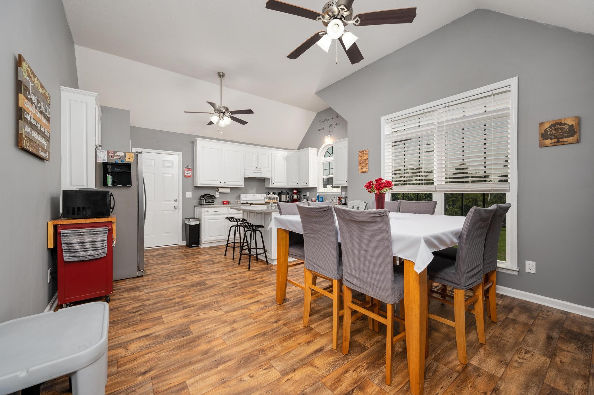 7040 Charity Road Petersburg, TN 37144 - Photo 9 of 36 a view of a dining room with furniture and wooden floor