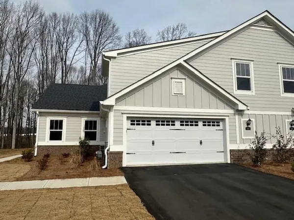 a view of a white house with a large windows
