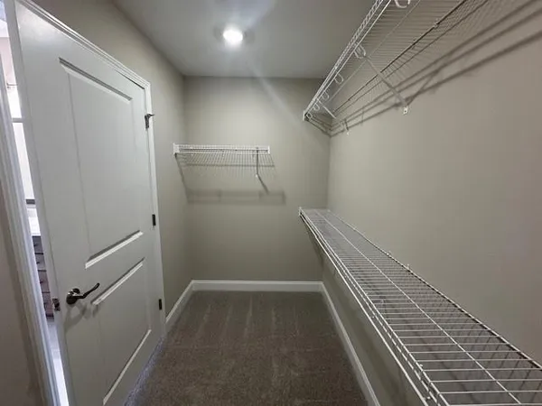 a view of a room with racks on the wall