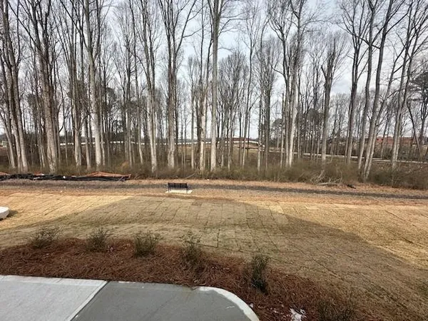 a view of a backyard of the house