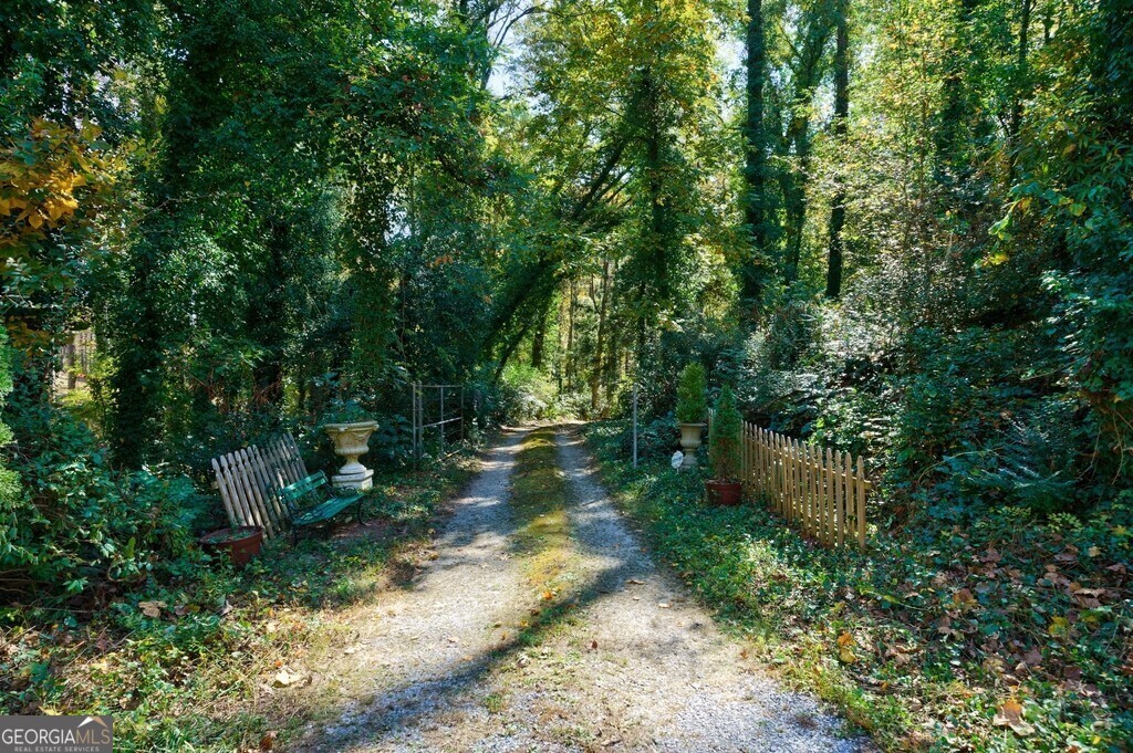 9505 Coleman Road Roswell, GA 30075 - Photo 1 of 1 a backyard of a house with lots of green space