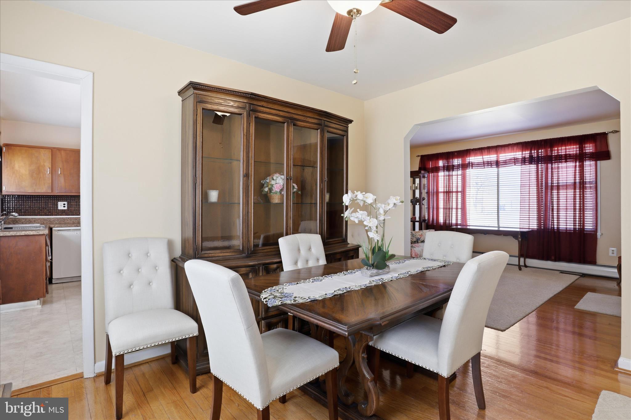 5811 Kirby Road Clinton, MD 20735 - Photo 11 of 43 a view of a a dining room with furniture window and wooden floor