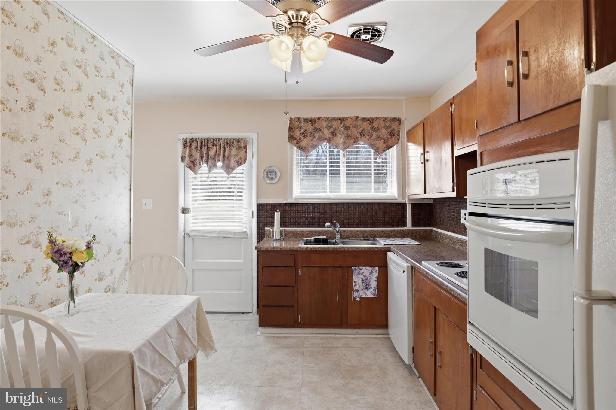 5811 Kirby Road Clinton, MD 20735 - Photo 12 of 43 a kitchen with stainless steel appliances granite countertop a stove and a refrigerator