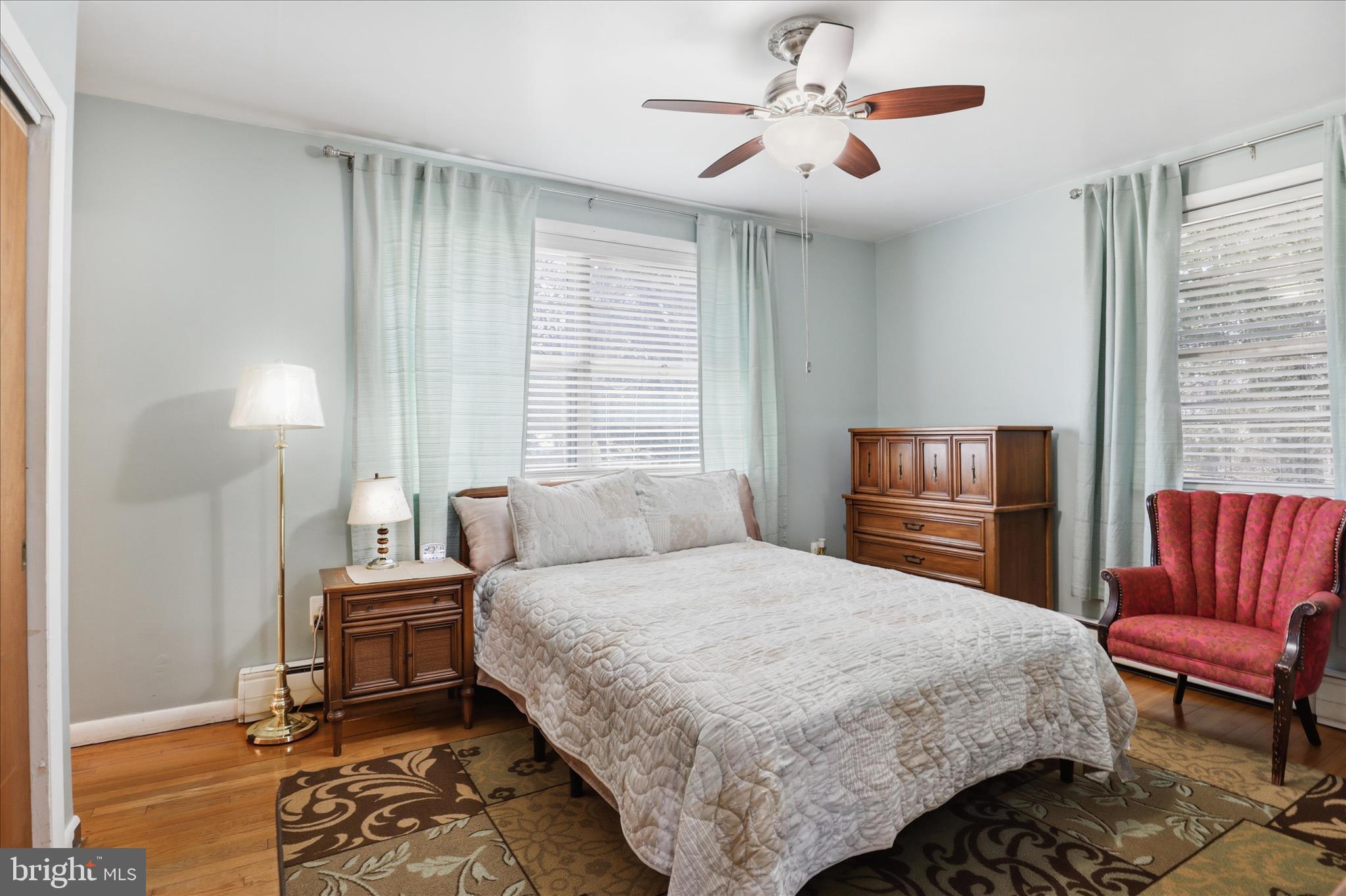 5811 Kirby Road Clinton, MD 20735 - Photo 15 of 43 a bedroom with a bed and chair