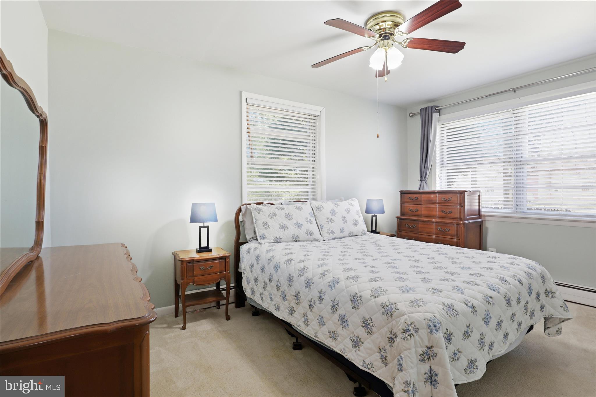 5811 Kirby Road Clinton, MD 20735 - Photo 19 of 43 a bedroom with a bed and a chandelier