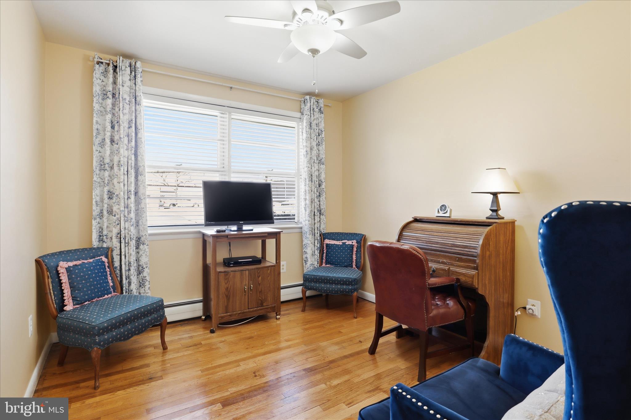 5811 Kirby Road Clinton, MD 20735 - Photo 21 of 43 a living room with furniture and a flat screen tv