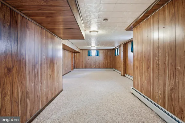 a view of hallway with wooden floor