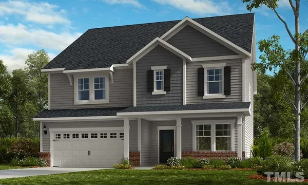 a view of a house with yard and plants