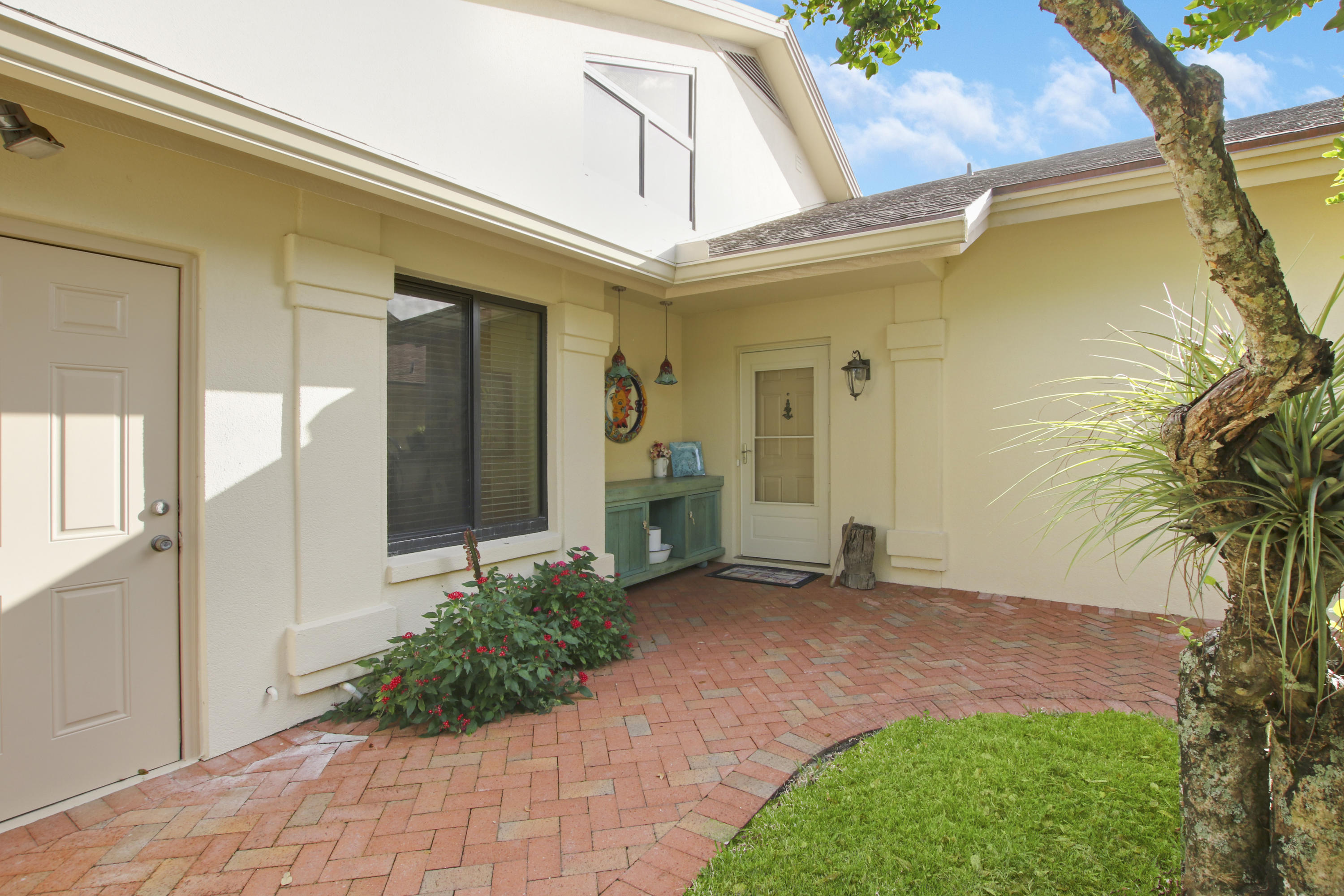 332 River Edge Road Jupiter, FL 33477 - Photo 101 of 103 a front view of a house with a yard