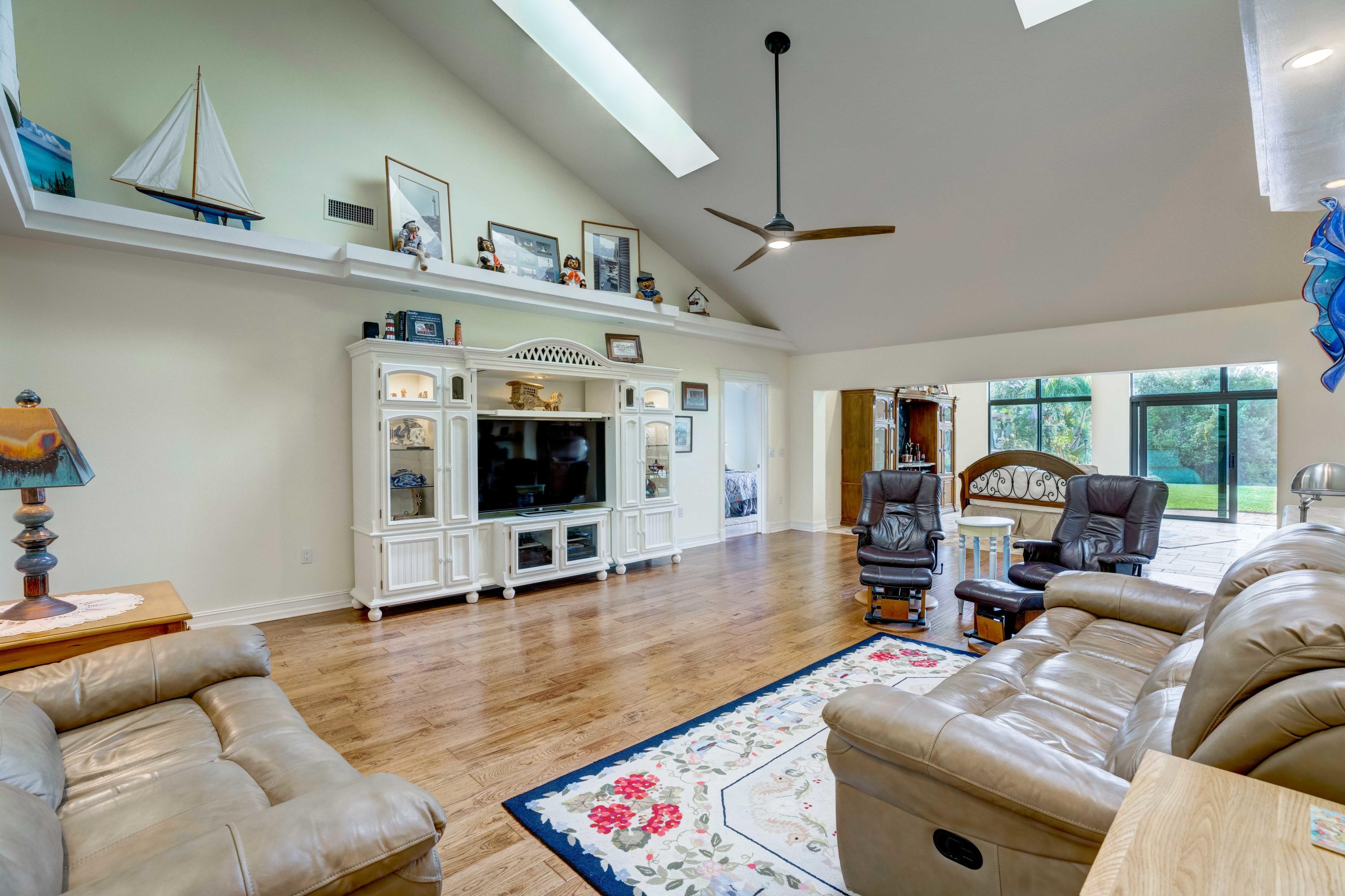 332 River Edge Road Jupiter, FL 33477 - Photo 15 of 103 a living room with furniture and a flat screen tv