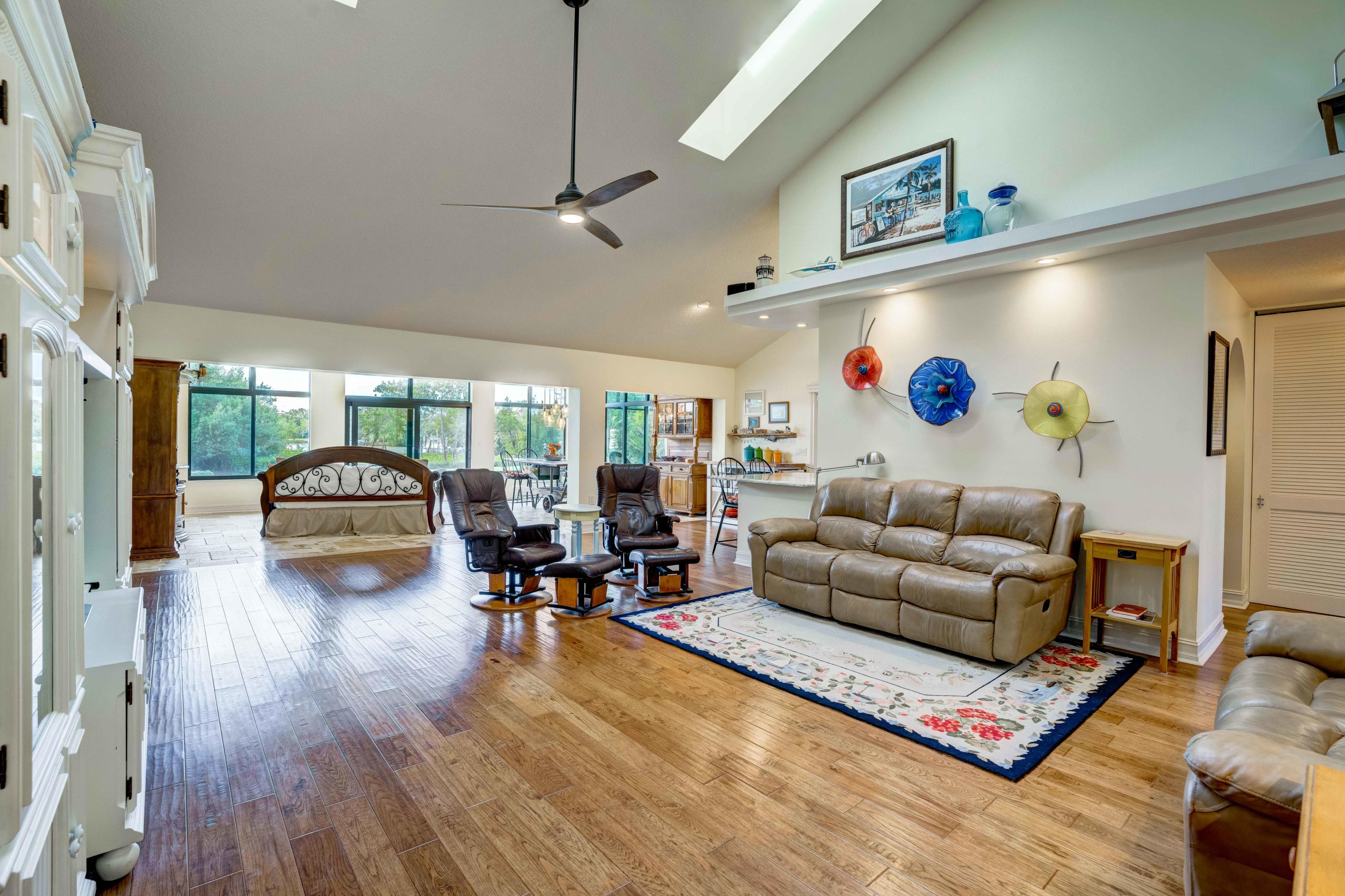 332 River Edge Road Jupiter, FL 33477 - Photo 16 of 103 a living room with furniture and a large window