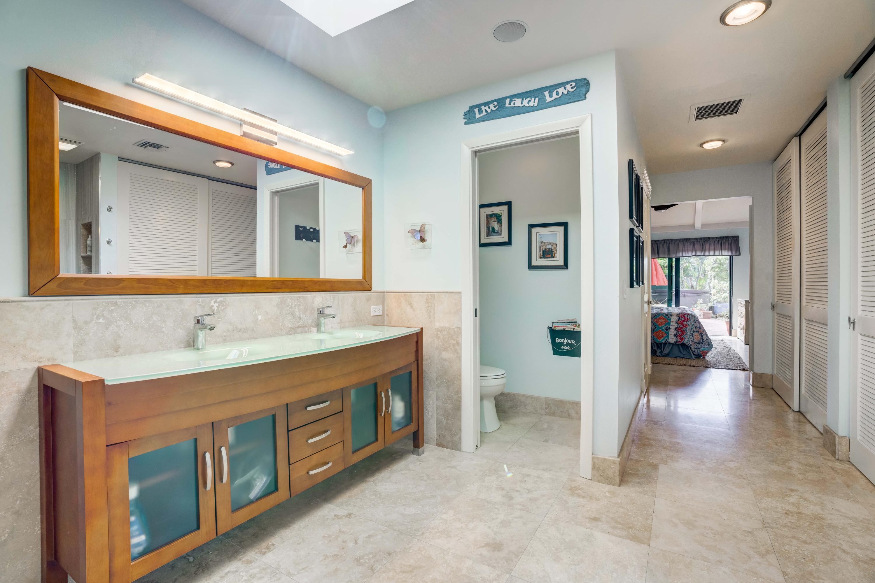 332 River Edge Road Jupiter, FL 33477 - Photo 26 of 103 a bathroom with a sink and a mirror
