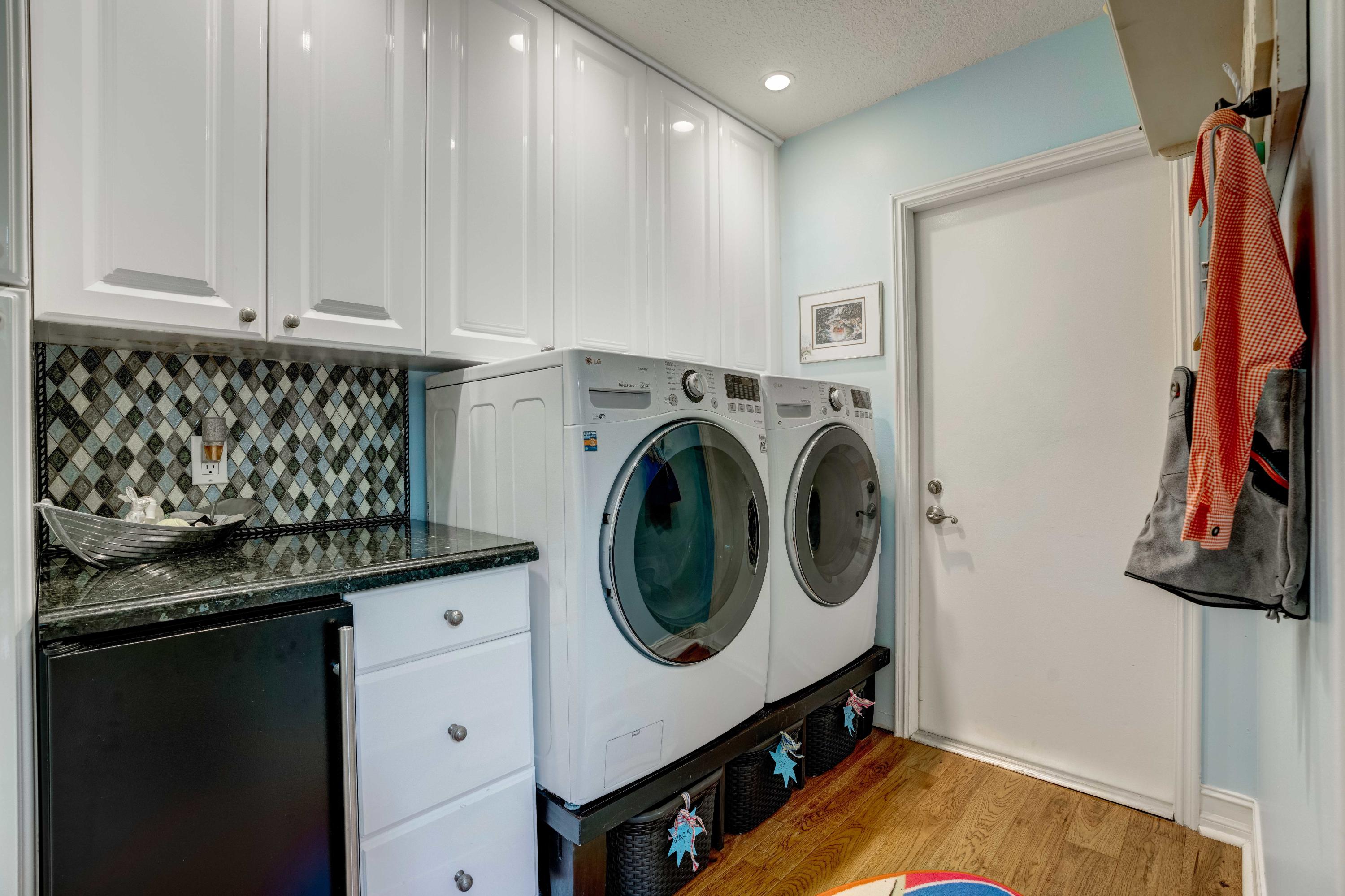 332 River Edge Road Jupiter, FL 33477 - Photo 28 of 103 a utility room with dryer and washer