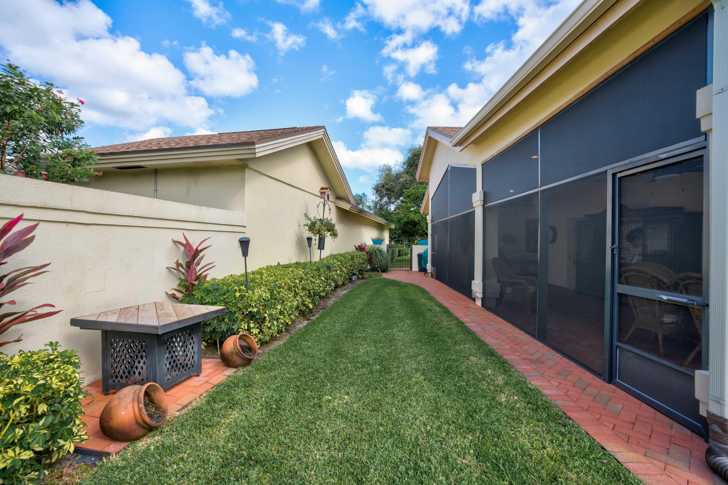 332 River Edge Road Jupiter, FL 33477 - Photo 31 of 103 a view of a back yard of the house