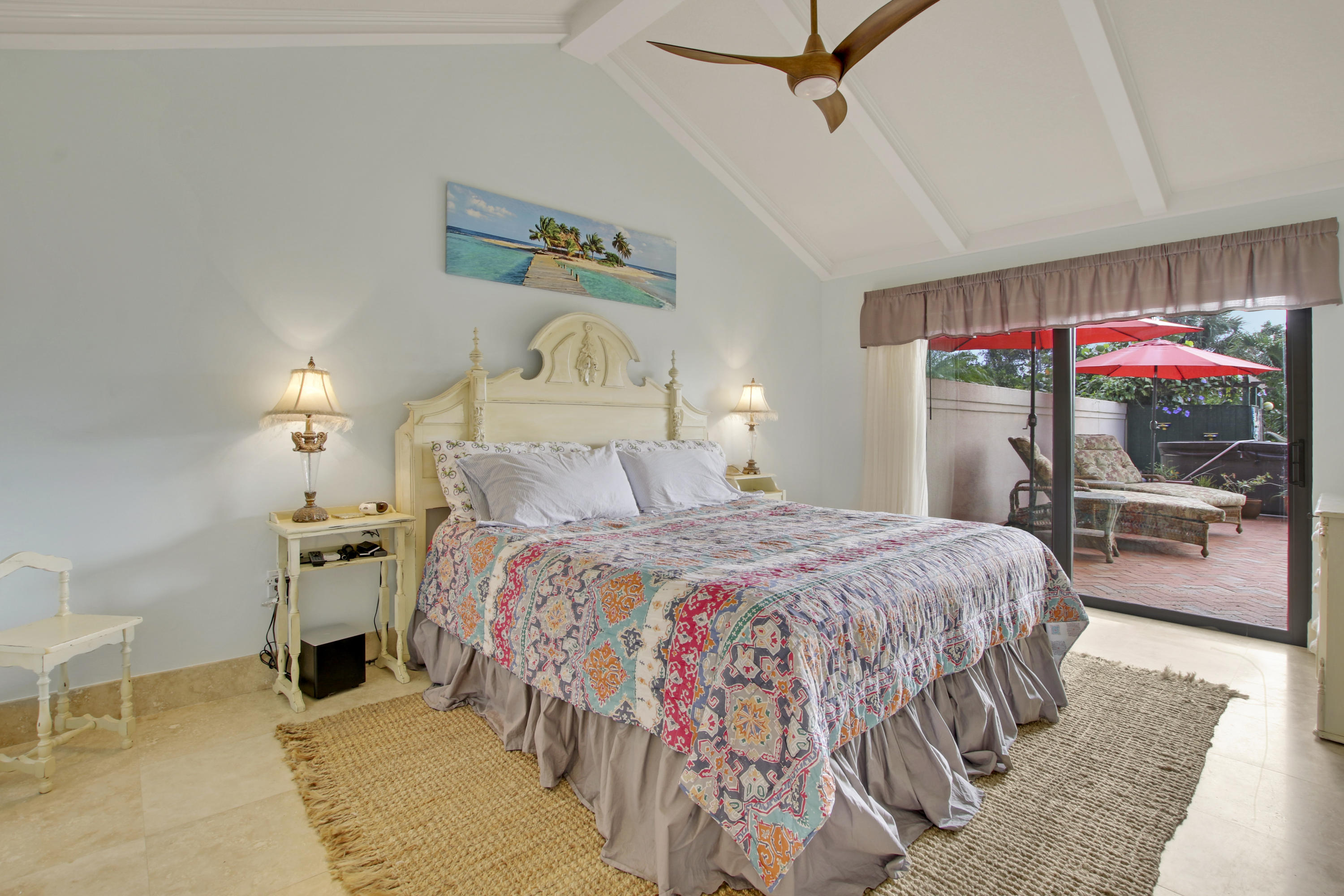 332 River Edge Road Jupiter, FL 33477 - Photo 72 of 103 a bedroom with a bed and large mirror