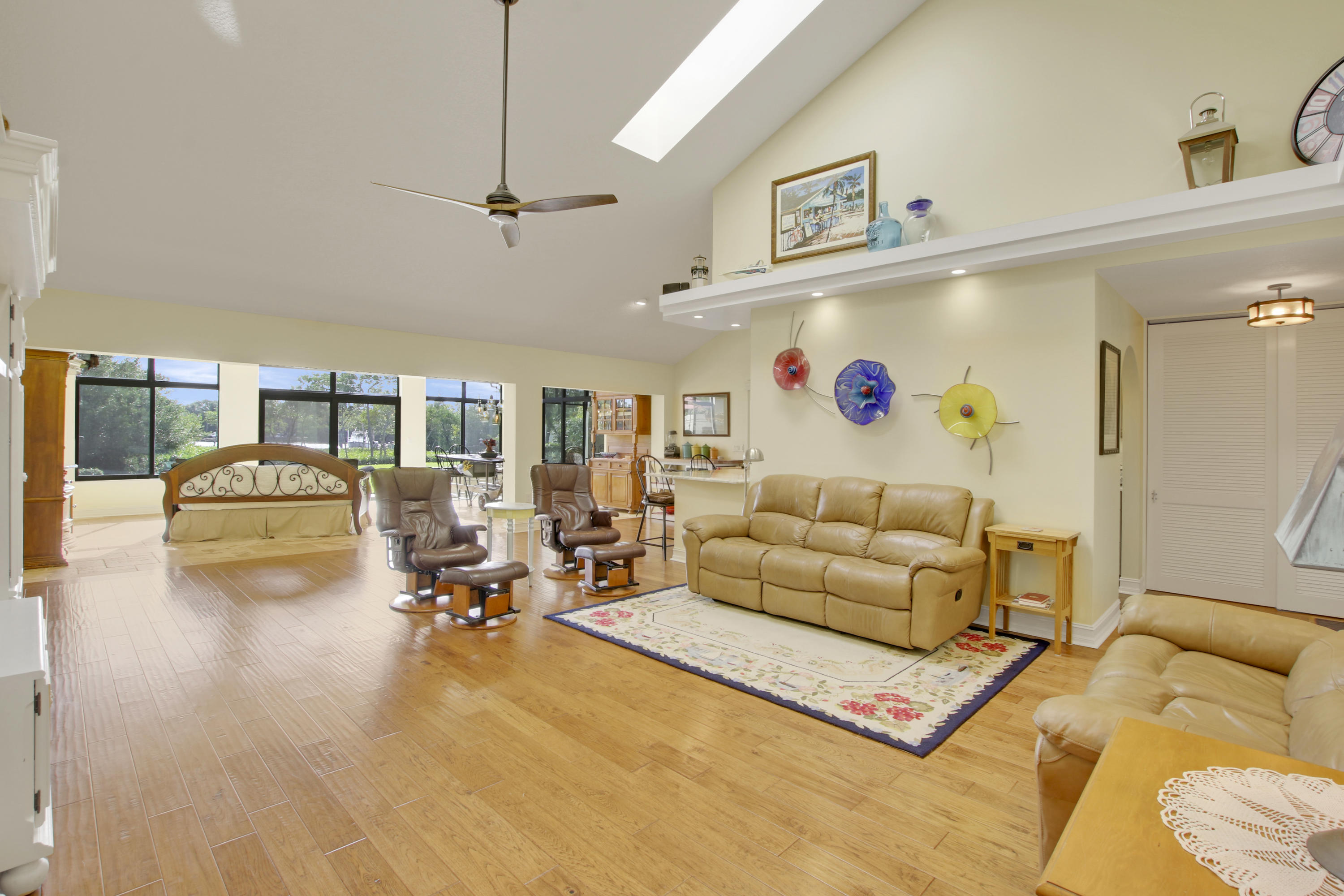 332 River Edge Road Jupiter, FL 33477 - Photo 83 of 103 a living room with furniture and a flat screen tv