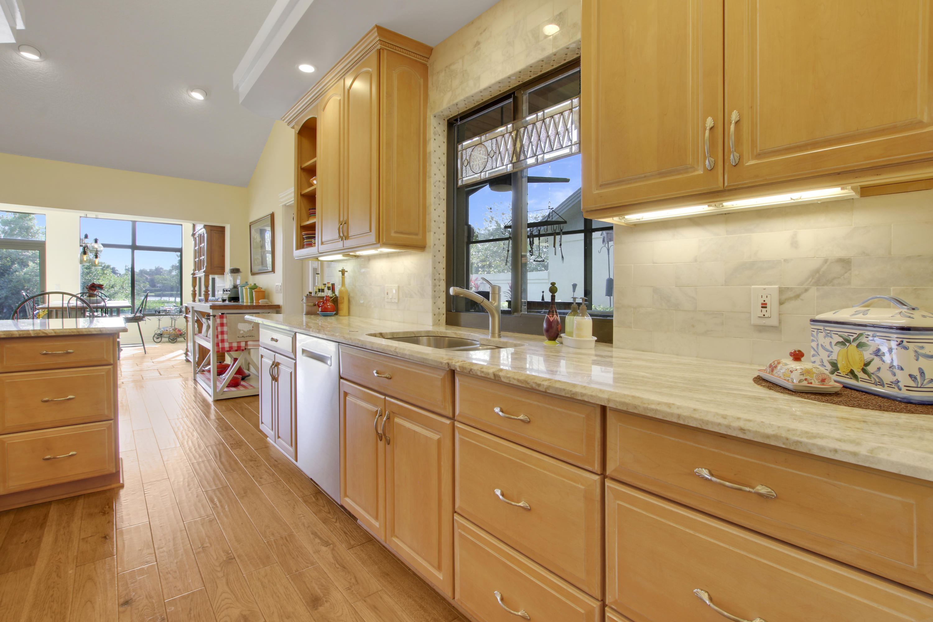 332 River Edge Road Jupiter, FL 33477 - Photo 89 of 103 a kitchen with lots of counter top space and wooden floor
