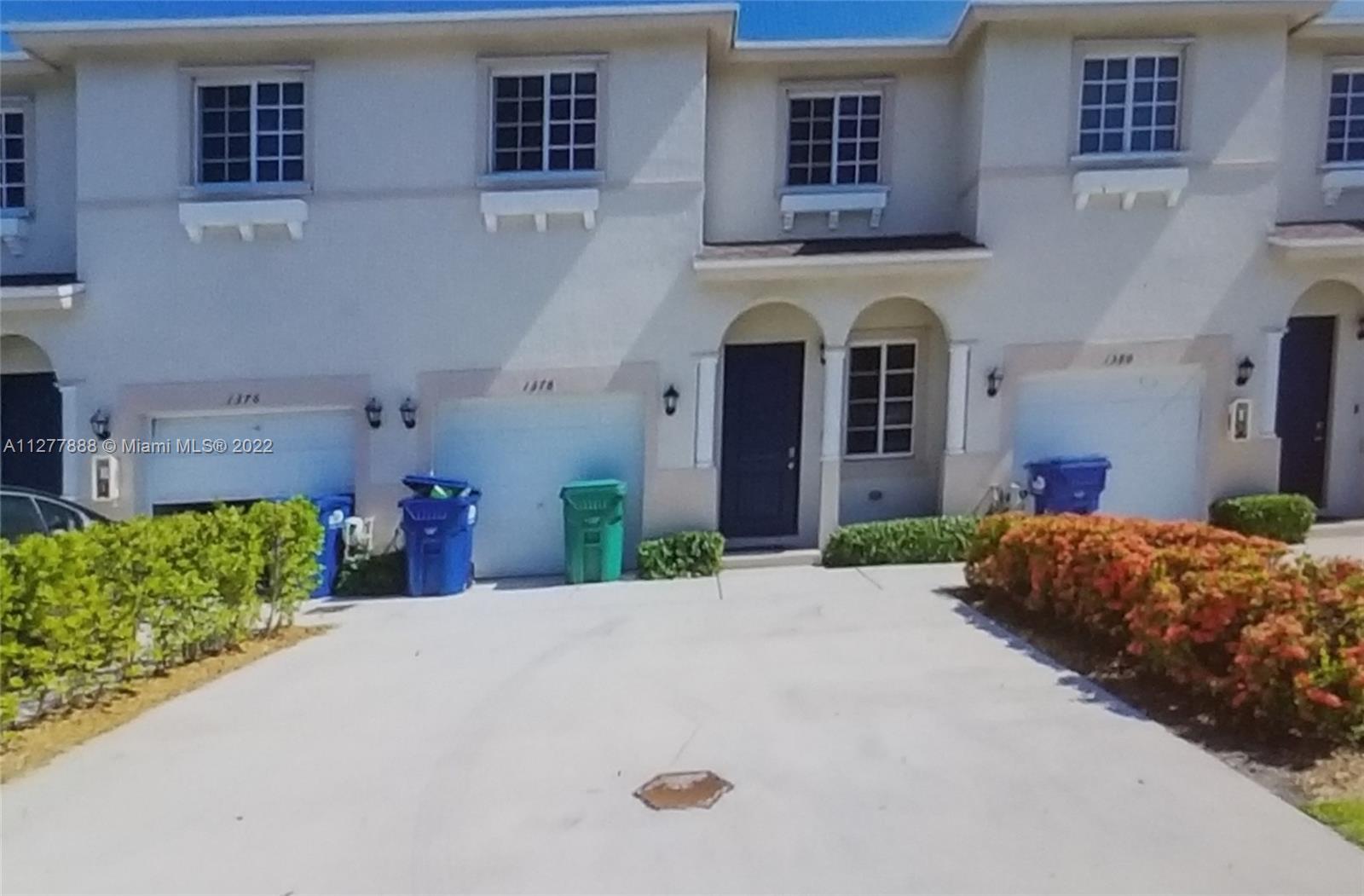 Walden Miami Gardens, FL 33169 - Photo 2 of 7 a front view of a house with a yard