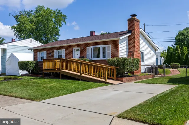 a view of a house with a yard porch and sitting area