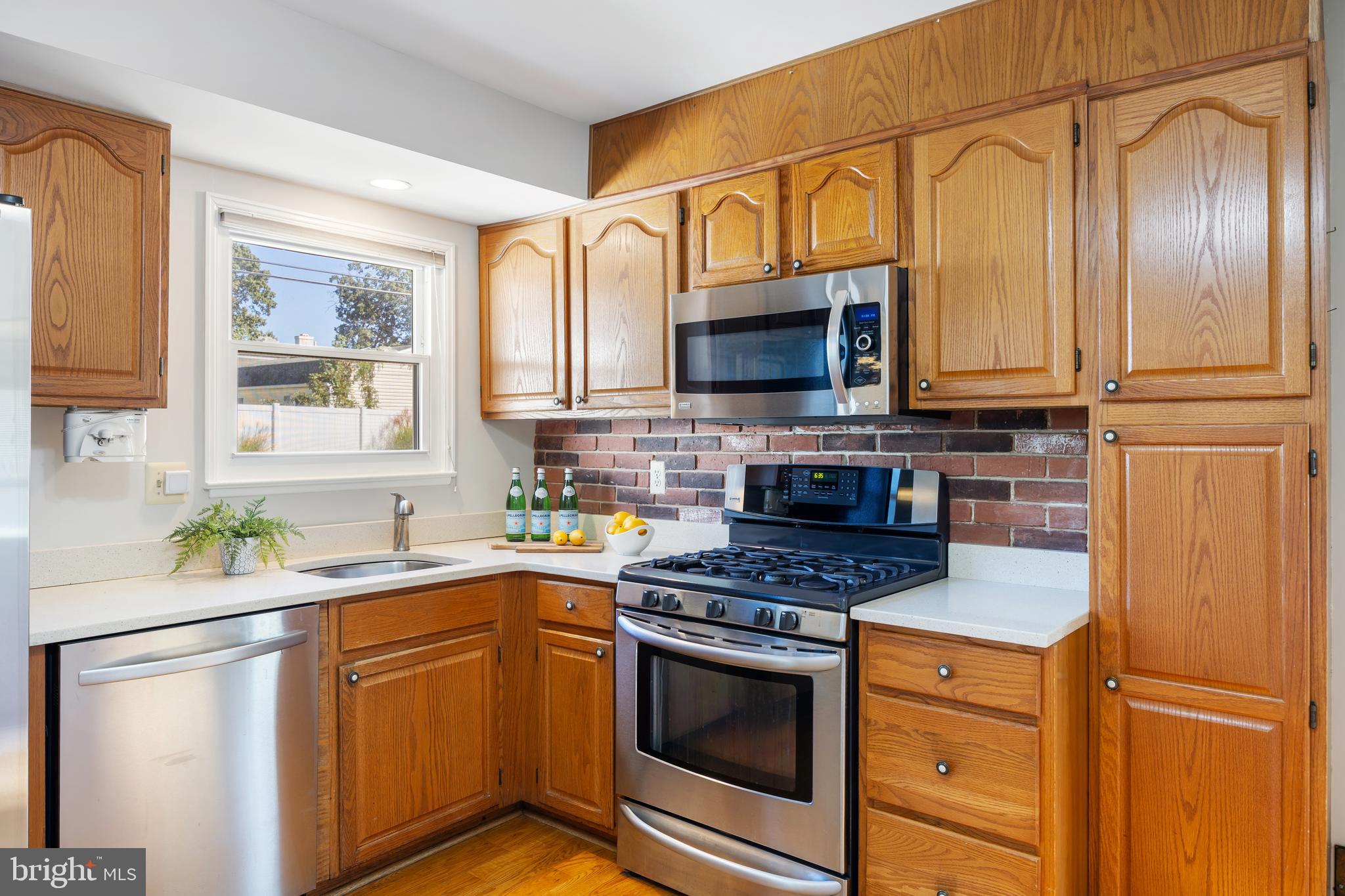 3816 Bayville Road Baltimore, MD 21220 - Photo 14 of 53 warm wooden cabinetry, & bright white countertop..