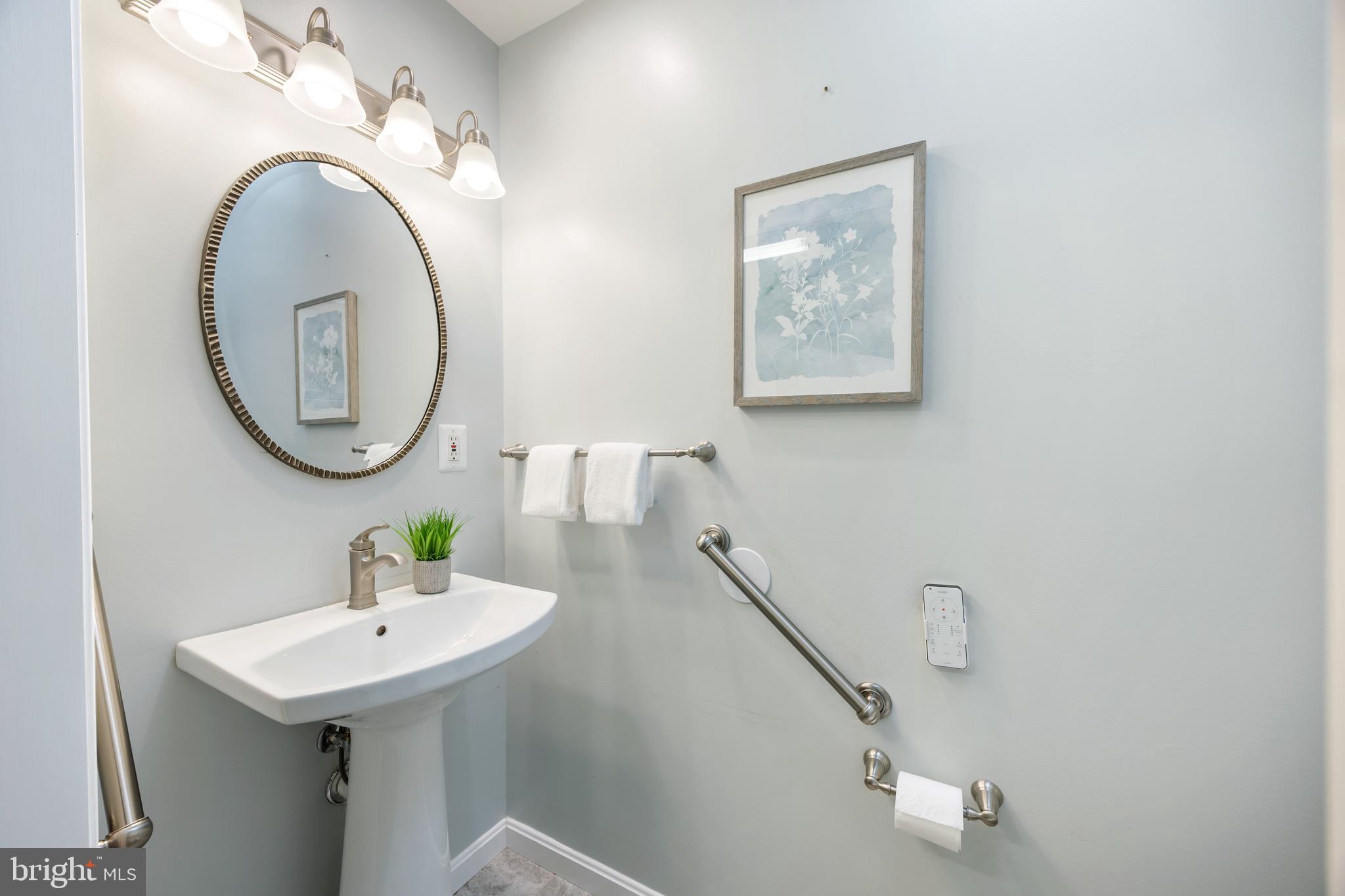 3816 Bayville Road Baltimore, MD 21220 - Photo 23 of 53 featuring a crisp white pedestal sink, brushed-...