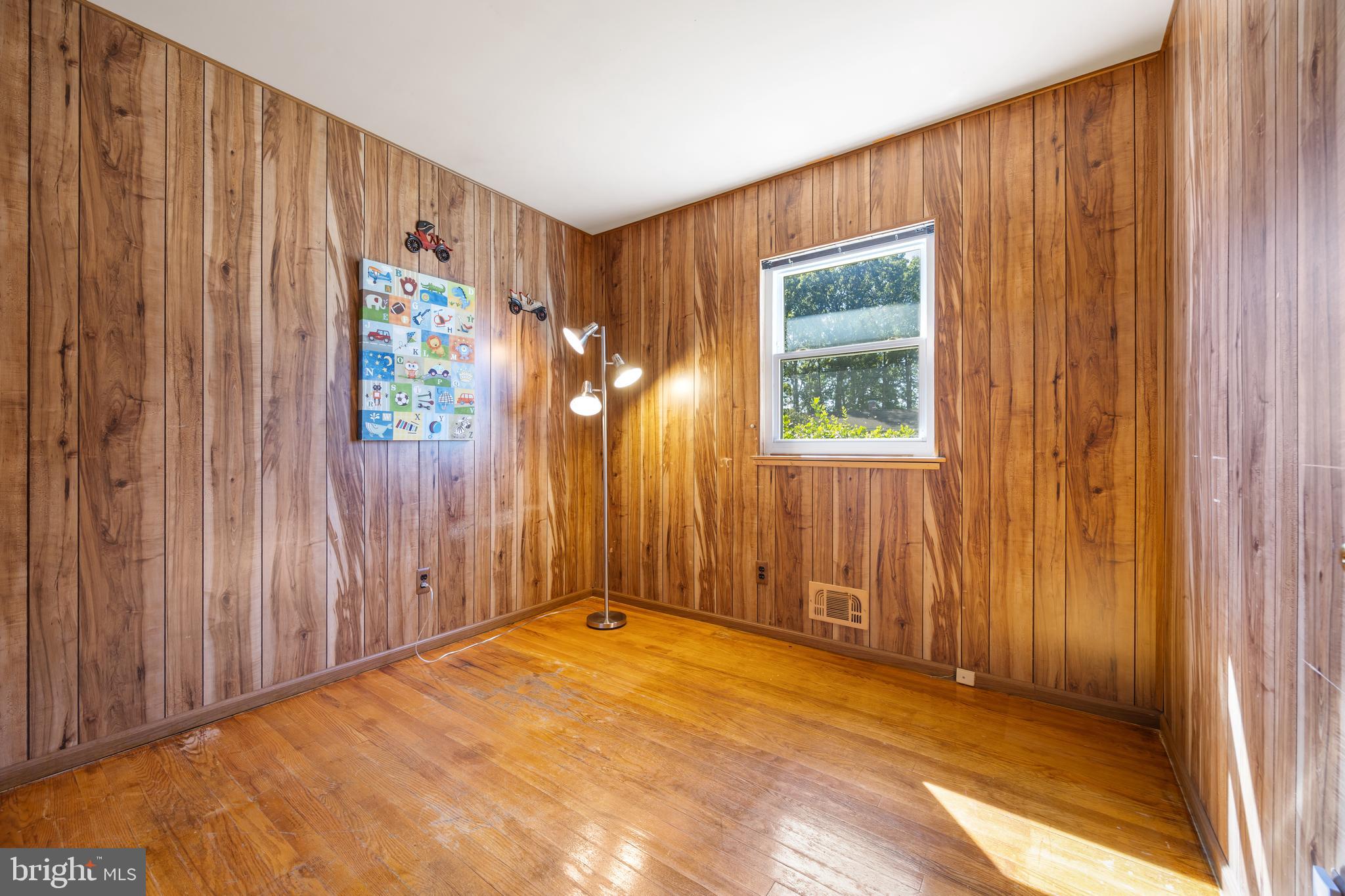 3816 Bayville Road Baltimore, MD 21220 - Photo 26 of 53 Cozy wood-paneled room with warm natural light