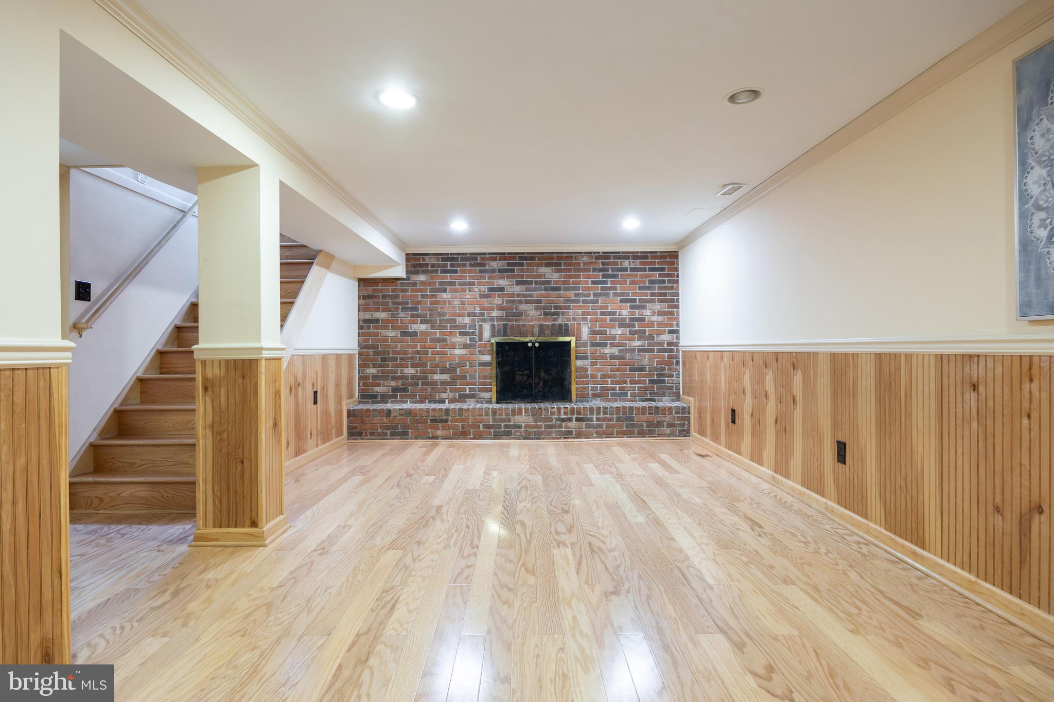 3816 Bayville Road Baltimore, MD 21220 - Photo 31 of 53 Spacious basement retreat w/ cozy brick fireplace