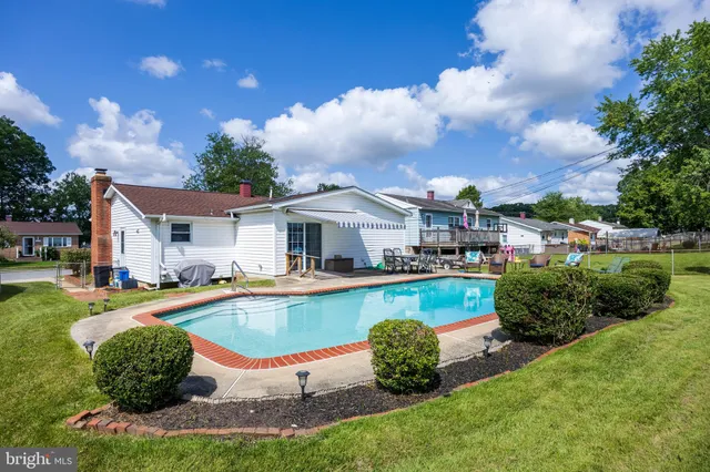 a view of a swimming pool with a lounge chairs