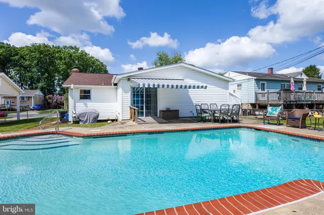 a view of a backyard with potted plants