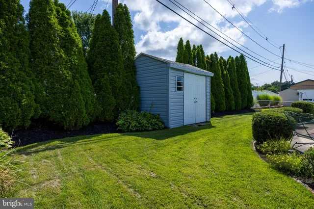 a view of a house with swimming pool and sitting area