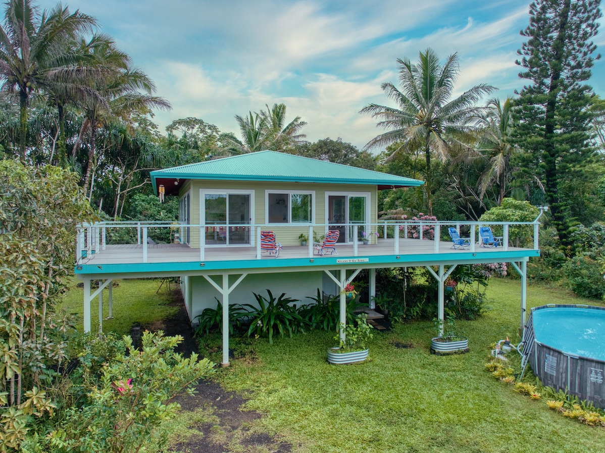 14-3674 Government Beach Road Pahoa, HI 96778 - Photo 1 of 29 a view of a house with a yard deck and furniture