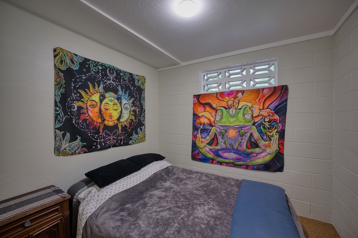14-3674 Government Beach Road Pahoa, HI 96778 - Photo 19 of 29 a room with painting on the wall and paintings on the wall
