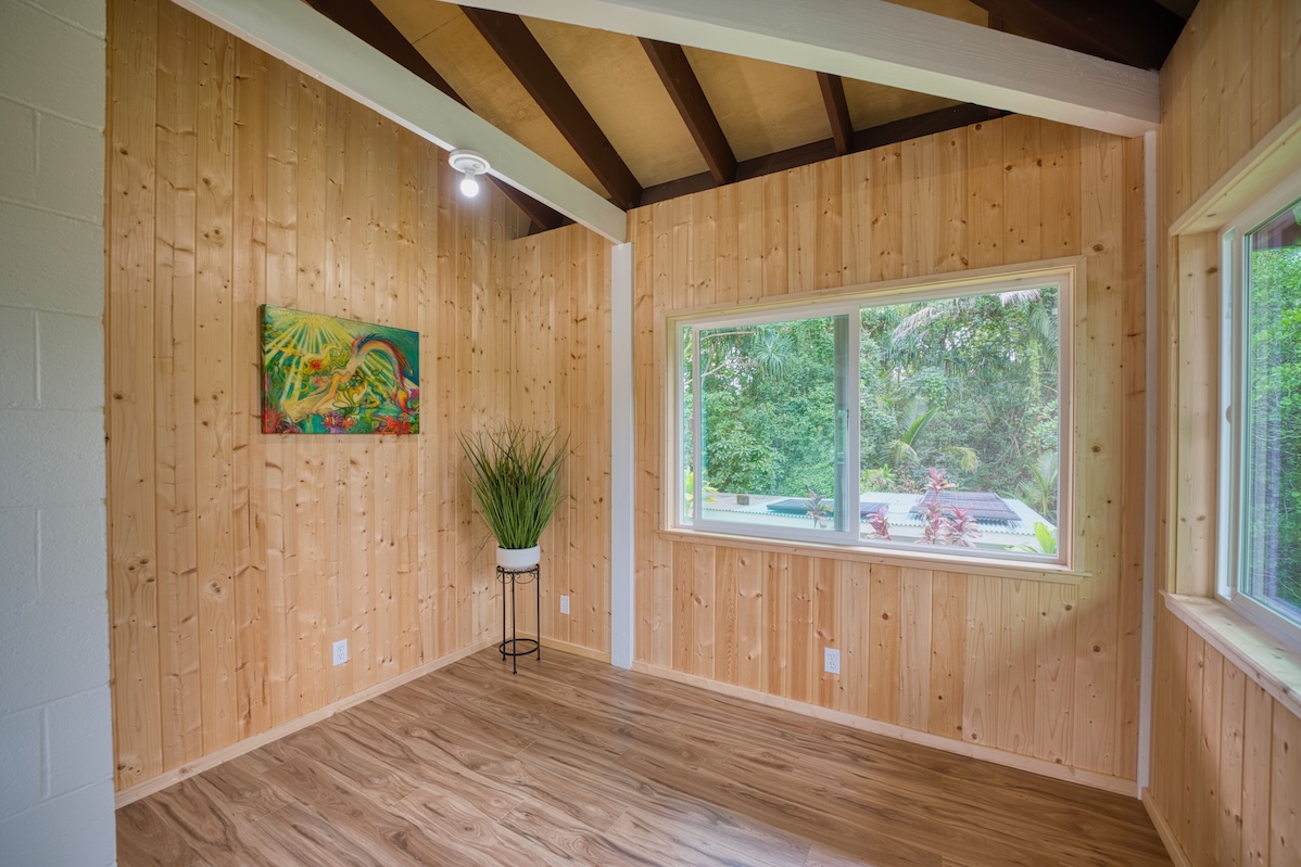 14-3674 Government Beach Road Pahoa, HI 96778 - Photo 5 of 29 a view of a house with wooden floor and a potted plant