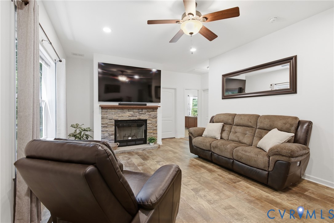 2575 Log Cabin Road Maidens, VA 23102 - Photo 17 of 36 Living area featuring wood-finish flooring, a ston