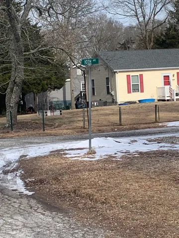 a house with trees in the background