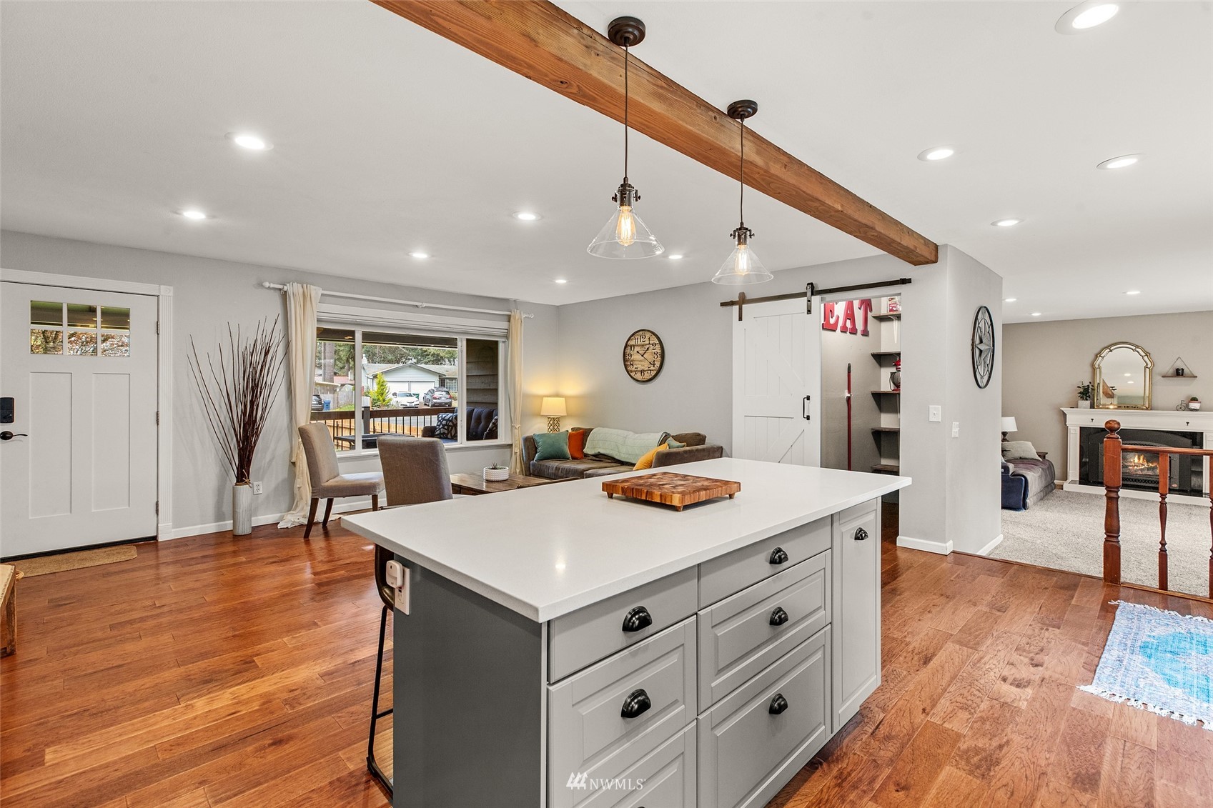 14627 Southeast 140th Street Renton, WA 98059 - Photo 11 of 33 a view of a a dining hall with furniture and wooden floor