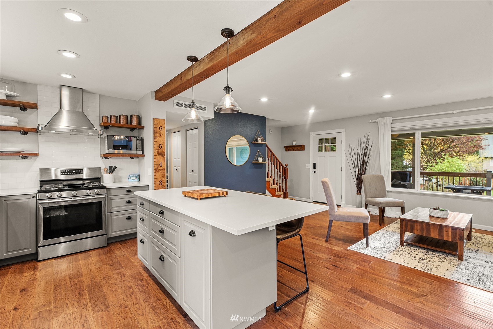 14627 Southeast 140th Street Renton, WA 98059 - Photo 12 of 33 a large kitchen with stainless steel appliances granite countertop a large center island and a stove top oven