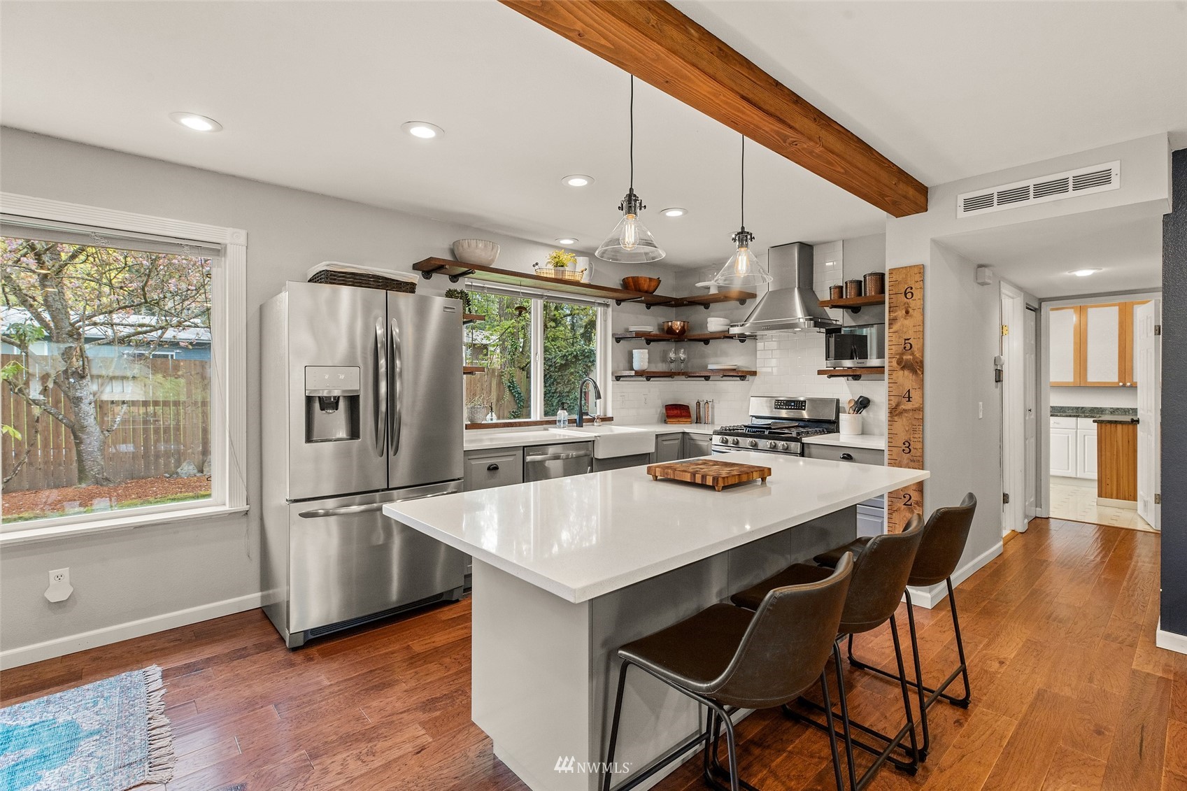 14627 Southeast 140th Street Renton, WA 98059 - Photo 13 of 33 a kitchen with stainless steel appliances granite countertop a sink a stove and a refrigerator