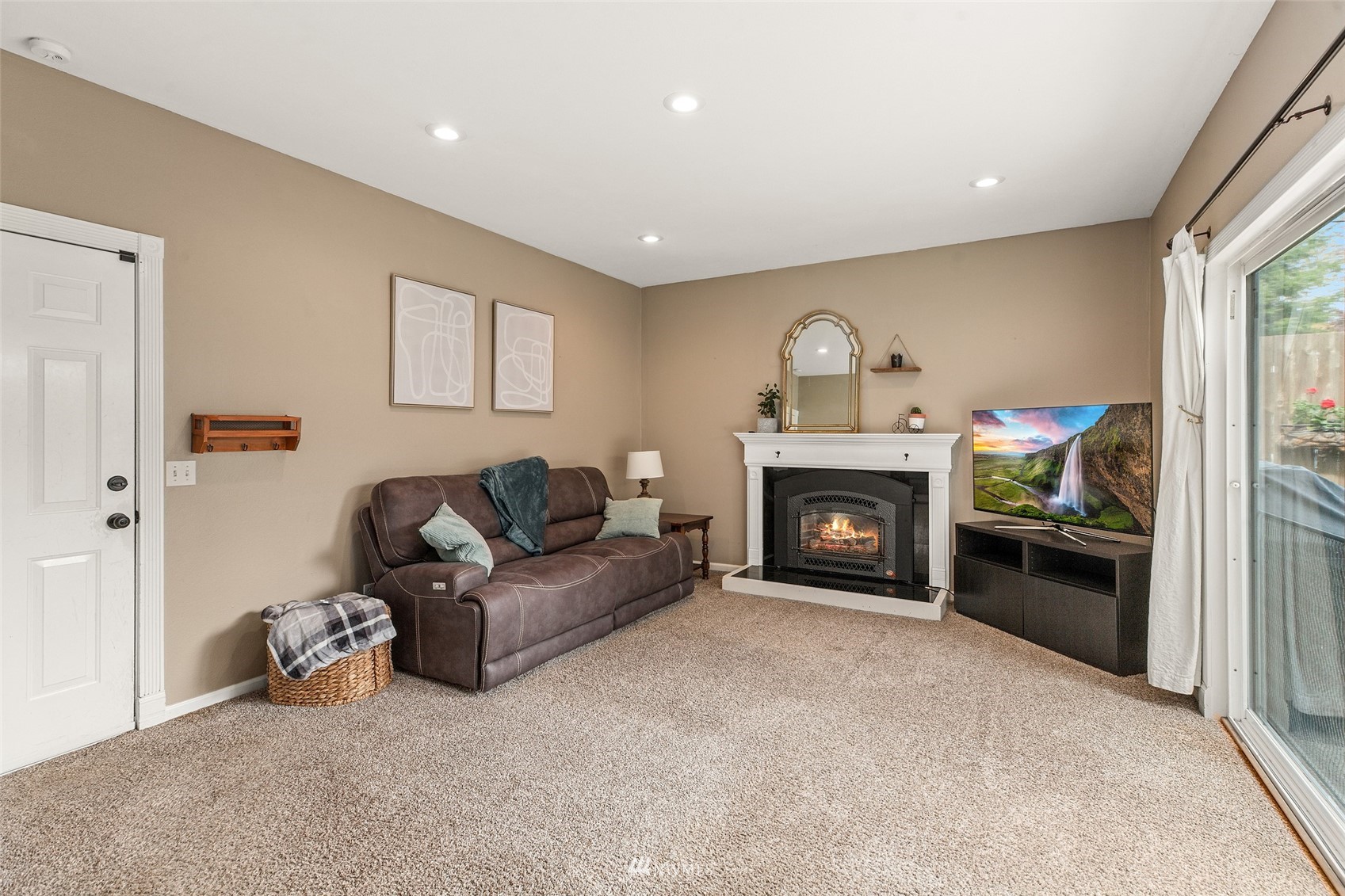 14627 Southeast 140th Street Renton, WA 98059 - Photo 15 of 33 a living room with furniture and a fireplace