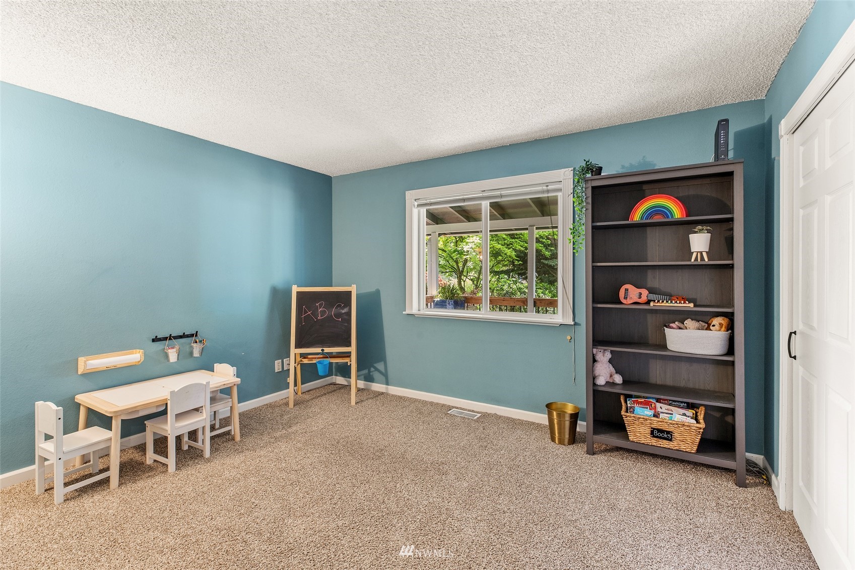 14627 Southeast 140th Street Renton, WA 98059 - Photo 16 of 33 a view of a livingroom with furniture and window