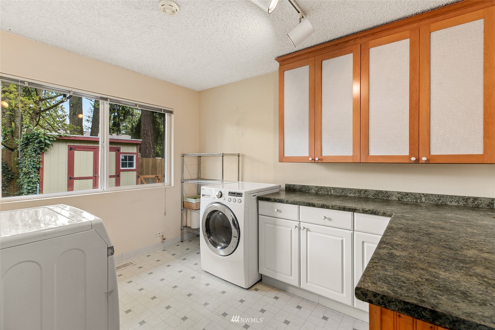 14627 Southeast 140th Street Renton, WA 98059 - Photo 17 of 33 a utility room with dryer and washer